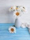 Chamomile bouquet shawl of a design plant vase retro textile on a wooden arrangement background, fabric