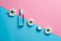 Chamomile cosmetics line showed on two colored backdrops, trendy cosmetic line commercial advertisement