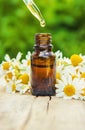 Chamomile extract in a small bottle. Royalty Free Stock Photo