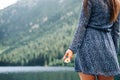 Chamomile flower. Happy girl in spring dress holding chamomile flower. Summer camomile, white daisy in woman hand. Young Royalty Free Stock Photo