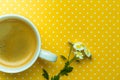 Chamomile Flowers And A Cup Of Coffee On A Yellow Polka Dot Background