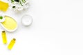 Chamomile spa cosmetics with natural herbal ingredients. Chamomile spa salt, soap, oil and cream on white background top Royalty Free Stock Photo