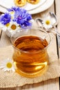 Chamomile tea on wooden table Royalty Free Stock Photo