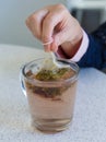 Chamomile teabag in glass mug on table Royalty Free Stock Photo