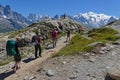 Several groups of hikers on the mountain paths around Mont-Blanc