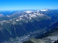 Chamonix village and alpine mountains range landscape seen from Aiguille du Midi Royalty Free Stock Photo