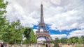 Champ de Mars and the Eiffel Tower timelapse in a sunny summer day. Paris, France