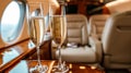 champagne on board a private jet. a flight on the board of a business class plane and two flutes of champagne. Toast in private Royalty Free Stock Photo