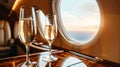 champagne on board a private jet. a flight on the board of a business class plane and two flutes of champagne. Toast in private Royalty Free Stock Photo