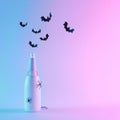 Champagne bottle with bats silhouettes and spiders in vibrant gradient holographic neon colors.