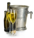 Champagne bottle with bucket ice and glasses of champagne, isolated on white. Royalty Free Stock Photo