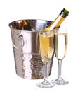 Champagne bottle in bucket with ice and glasses of champagne Royalty Free Stock Photo