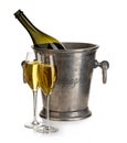 Champagne bottle with bucket ice and glasses of champagne, isolated on white. Festive still life. Royalty Free Stock Photo