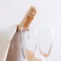 Champagne bottle in bucket and two empty glasses Royalty Free Stock Photo