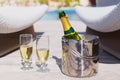 Champagne bottle in bucket and two glasses of champagne Royalty Free Stock Photo