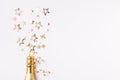 Champagne bottle with confetti stars and party streamers on festive background. Christmas, birthday or wedding concept. Flat lay Royalty Free Stock Photo