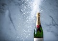 Champagne bottle explodes with bubbles and sparkle Royalty Free Stock Photo