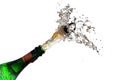 champagne bottle explosion with cork popping splash isolated against a white background, copy space, selected focus, motion blur Royalty Free Stock Photo
