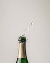 Champagne bottle with fizzy drink splashing out. Royalty Free Stock Photo