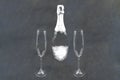 Champagne bottle with flutes