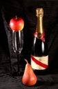 Champagne bottle , glass , apple