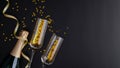 Champagne bottle, glasses, golden confetti on black background. Christmas or birthday celebration concept. Flat lay, top view, Royalty Free Stock Photo