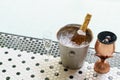 Champagne bottle in ice bucket and two glasses near bubble pool Royalty Free Stock Photo