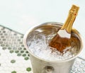 Champagne bottle in ice bucket and two glasses near jacuzzi pool Royalty Free Stock Photo