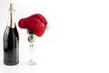 The champagne bottle with Santa hat and champagne glass with Christmas decorations Royalty Free Stock Photo