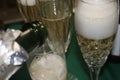 Champagne bubbles in a crystal glass wth more champagne being poured