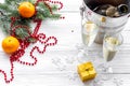 Champagne for celebrate new year. Glasses, bottle in bucket, spruce branch on white wooden background copyspace Royalty Free Stock Photo