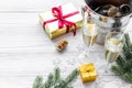 Champagne for celebrate new year. Glasses, bottle in bucket, spruce branch on white wooden background copyspace Royalty Free Stock Photo