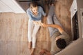 Champagne, cheers and happy couple on the kitchen floor celebrating their new home renovations. Top view of happiness Royalty Free Stock Photo