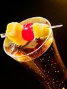 Champagne cocktail with cherry and pineapple Royalty Free Stock Photo