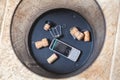 Champagne corks and mobile phone at bottom trash Royalty Free Stock Photo