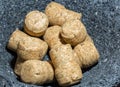 Champagne corks in stone bowl Royalty Free Stock Photo