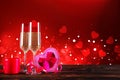 Champagne for couple in love in two flutes on table with red tablecloth Royalty Free Stock Photo