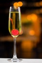 Champagne served with cherry in glass Royalty Free Stock Photo