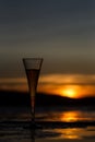 Champagne flute glass against sunset Royalty Free Stock Photo