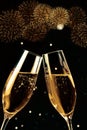 Champagne flutes with golden bubbles make cheers with fireworks sparkle and black background