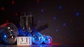 Champagne flutes, disco balls,  fir branch. New Year. 31 december Royalty Free Stock Photo