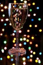 Champagne with garland on the background Royalty Free Stock Photo