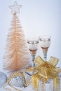 Champagne, gift box, snow, christmas toys and fir-tree Royalty Free Stock Photo