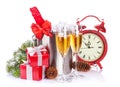 Champagne, gift boxes and christmas clock Royalty Free Stock Photo