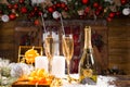 Champagne and Gifts in front of Christmas Cabin Royalty Free Stock Photo