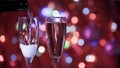 Champagne glass close up on Christmas and New Year holiday bokeh background Royalty Free Stock Photo