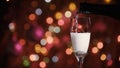 Champagne glass close up on Christmas and New Year holiday bokeh background Royalty Free Stock Photo