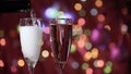 Champagne glass close up on Christmas and New Year holiday bokeh background Royalty Free Stock Photo