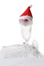 Champagne glass decorated with santa hat Royalty Free Stock Photo