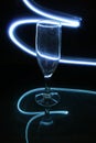 Champagne glass with labyrinths of blue light